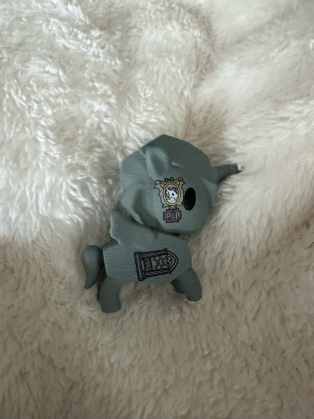 tokidoki gray Arcane unicorno figure with black and gold details